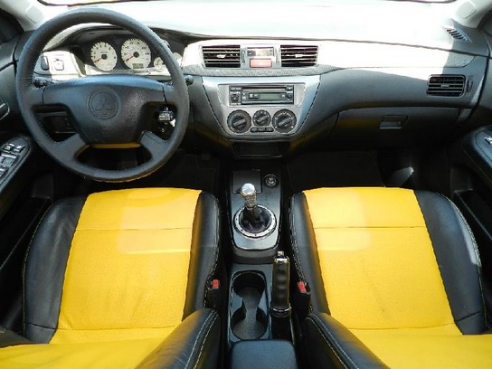 yellow mitsubishi lancer 2022 interior